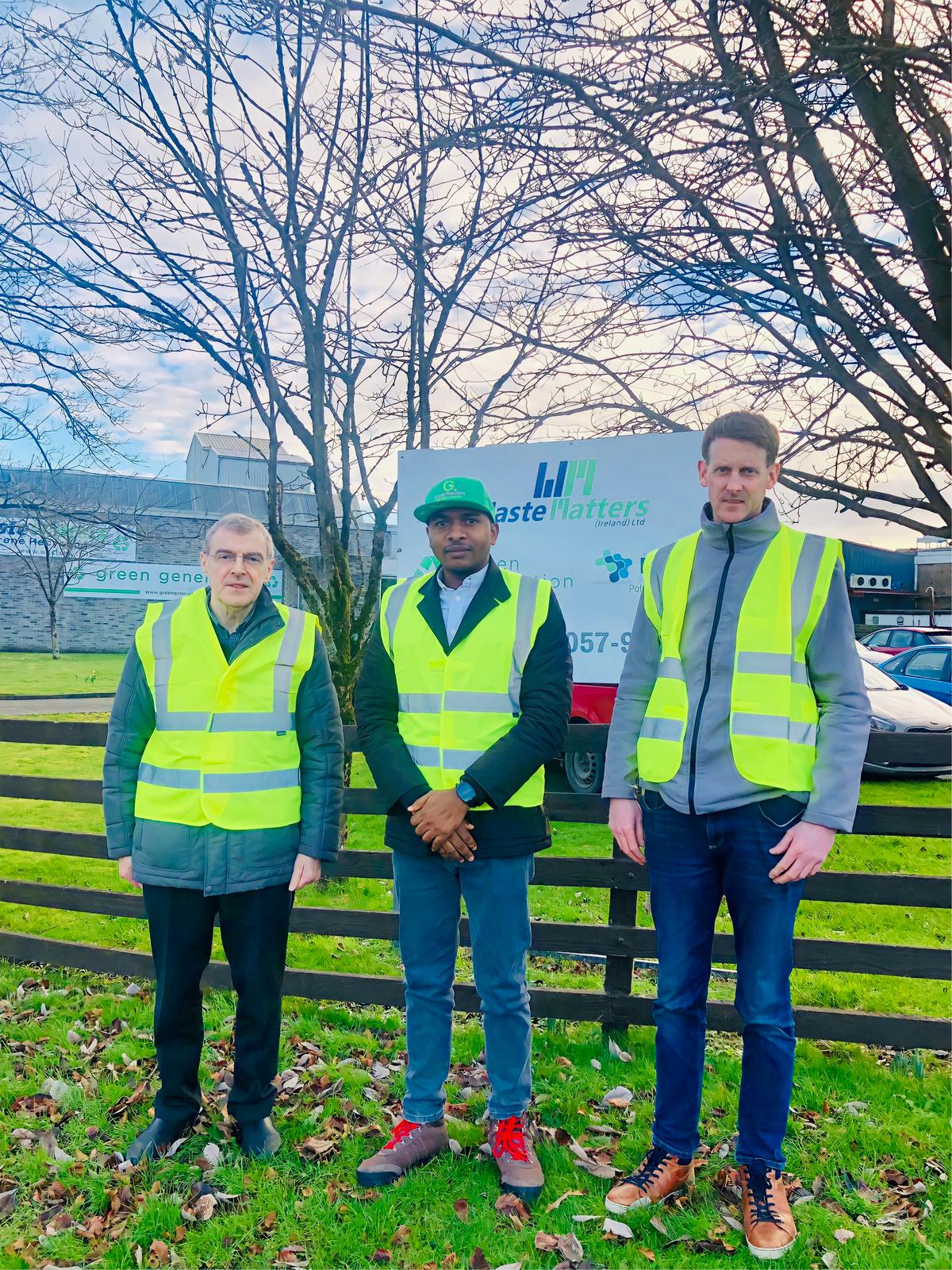 Dr. Ezulike at a recycling facility with business partners